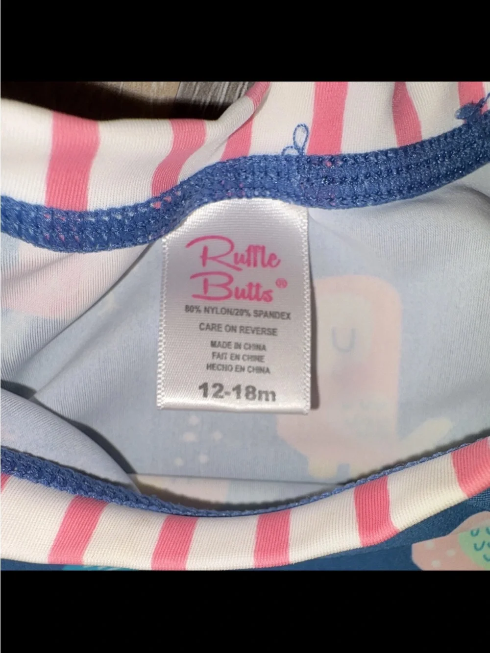Ruffle Butts Navy Bird Print Long-Sleeve Rashguard with Pink Stripes